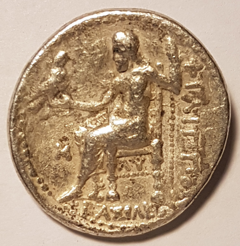  Zeus enthroned with his sacred Eagle is pictured on the reverse of the coin.  
