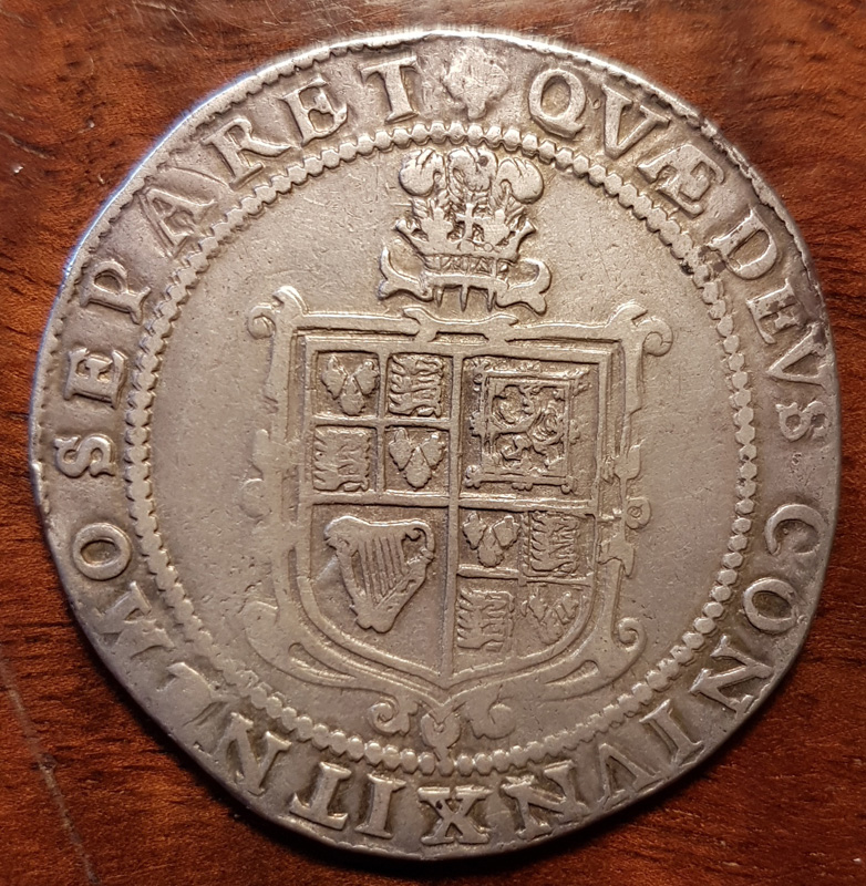 reverse showing shield and plumes