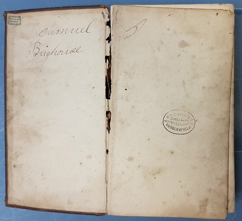 Bible open , signed 'Samuel Brighouse' 