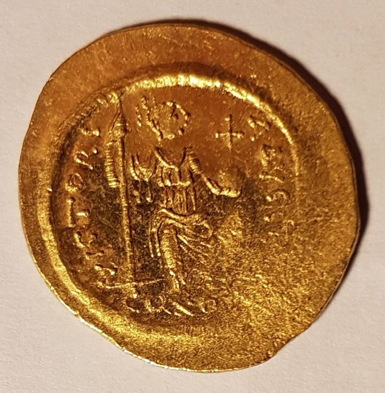Constantinopolis seated right, holding spear and globus cruciger