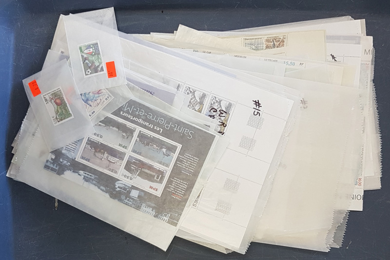 Spread of stamp blocks in transparent envelopes