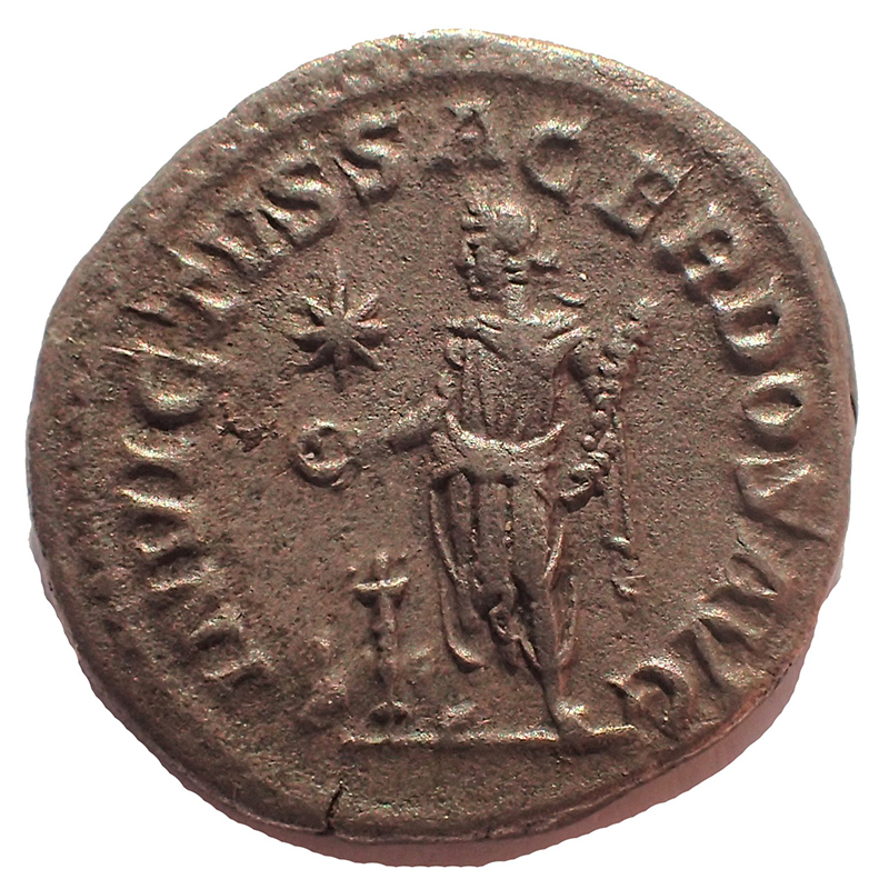 INVICTVS SACERDOS AVG Elagabalus standing left, holding patera sacrificing over altar and holding club upright, bull lying down behind altar.