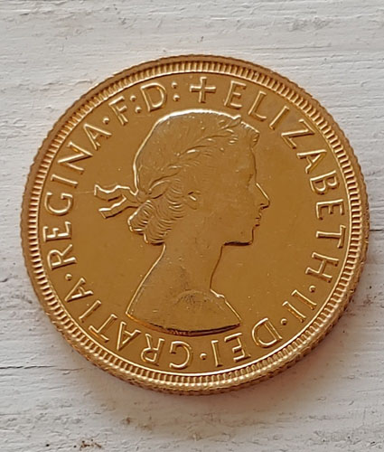 G.B. 1958 QEII Gold Sovereign lt scratch .234oz AGW