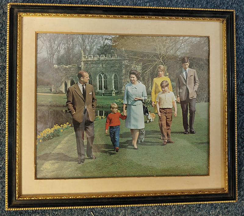 same Colour photograph of royal family, behind glass of frame